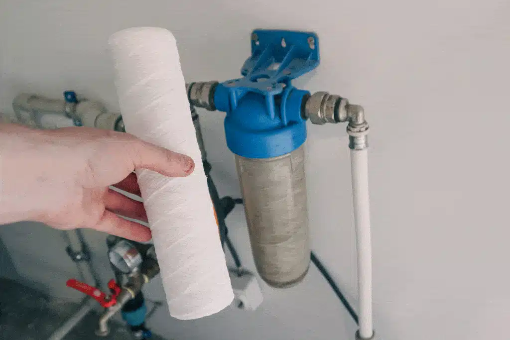 plumber-chaning-out-water-filter-whole-house-water-filtration-dallas-tx-frisco-tx