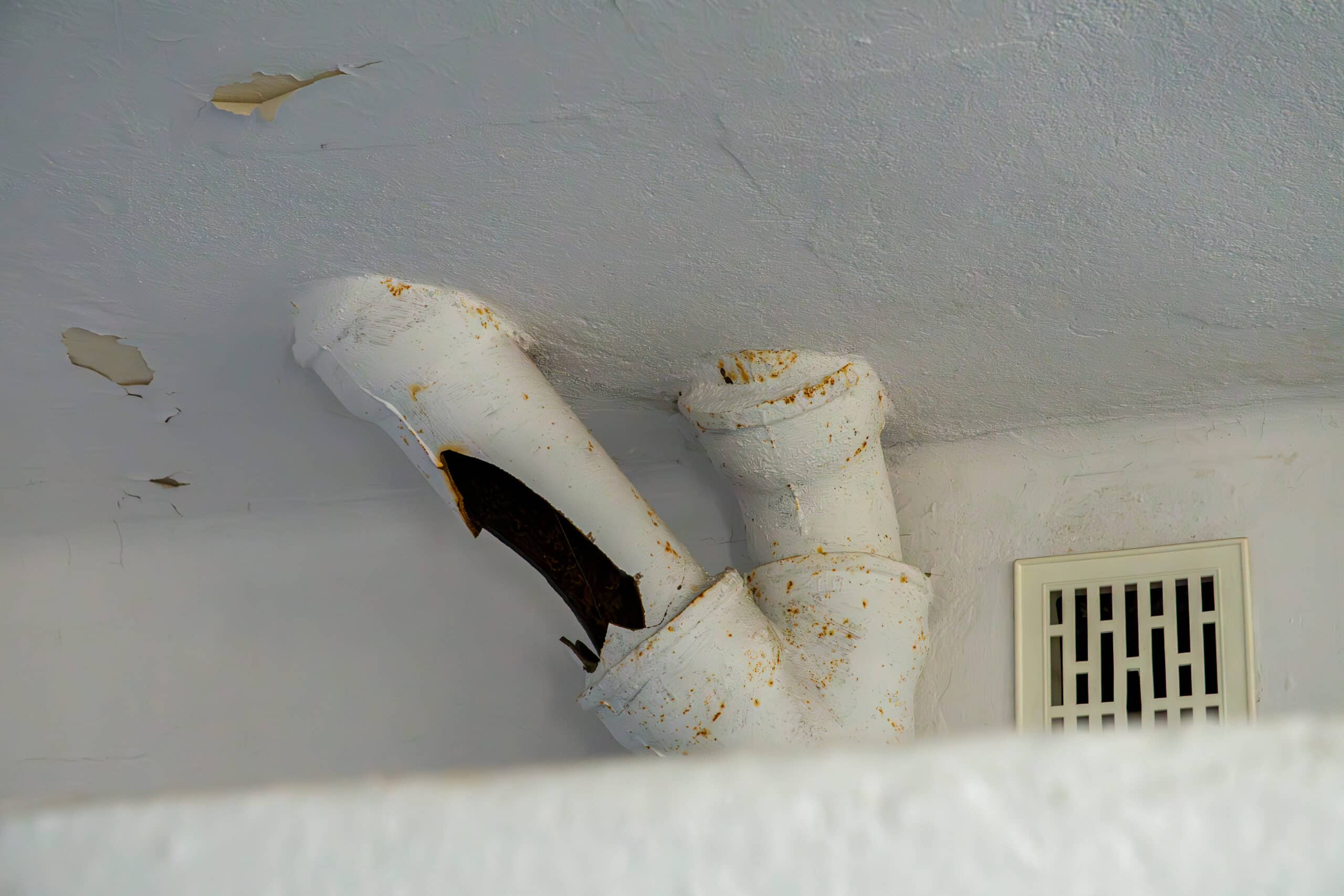 Cracked and rusty sewage pipe, Sewer Odor Smoke Test.