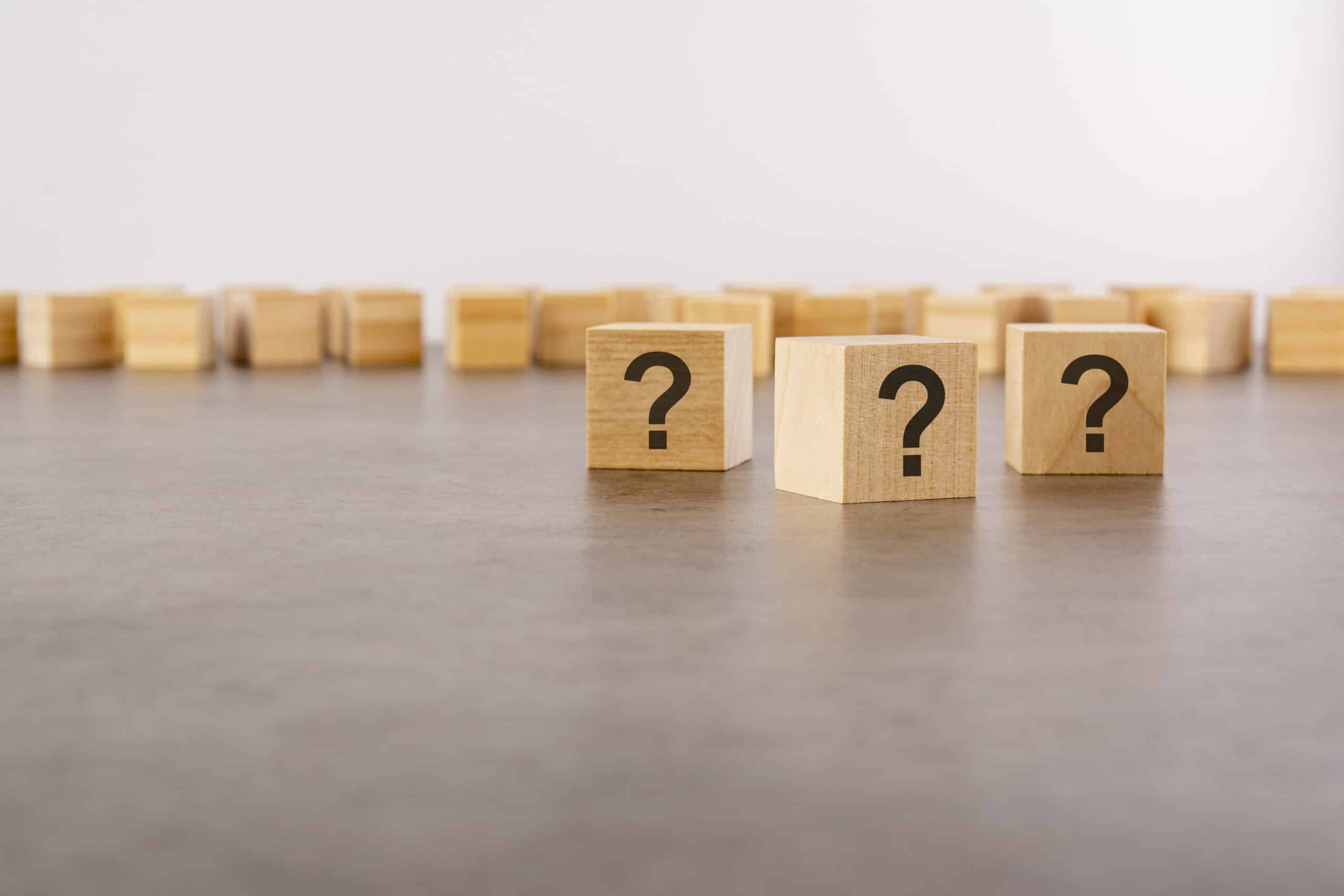 Wood cubes with question marks, Sewage ejector basics.