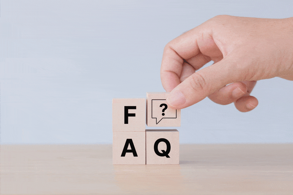hand putting FAQ blocks on table emergency plumber dallas tx plano tx